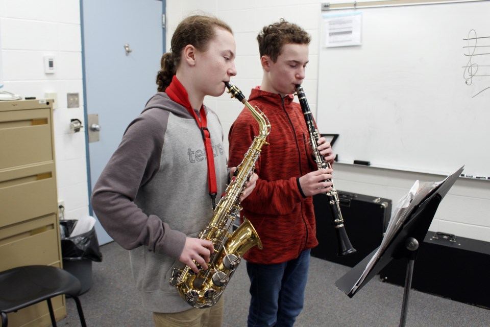 Twins Joshua (left) and Michael Gamblin (right), Grade 8 students at H.E. Bourgoin Middle School, are among junior and senior high school students participating in the University of Alberta High School Honour Band. Photo by Robynne Henry. 