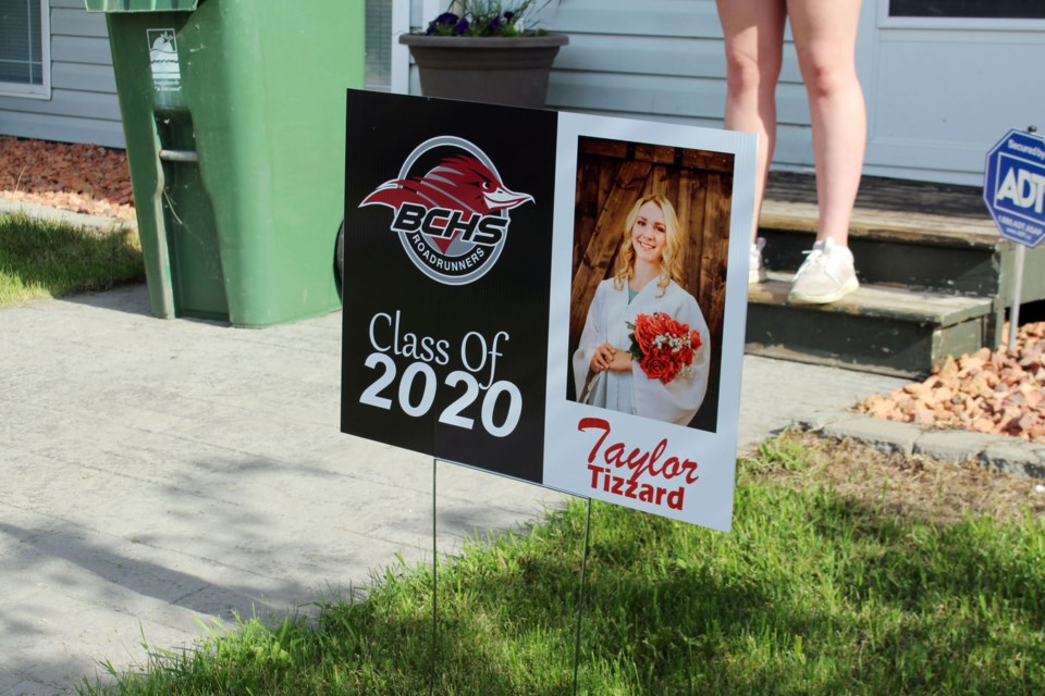 Staff and teachers from Bonnyville Centralized High School drove around town on Friday, June 12 delivering yard signs, diplomas, and caps and gowns to the 2020 graduating class. Photo by Robynne Henry.