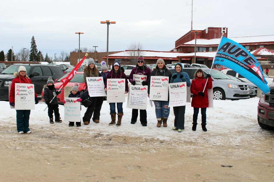 A rally was held at the Bonnyville Healthcare Centre on Thursday by nurses to raise awareness about the proposed cuts to healthcare. Photo by Robynne Henry. 