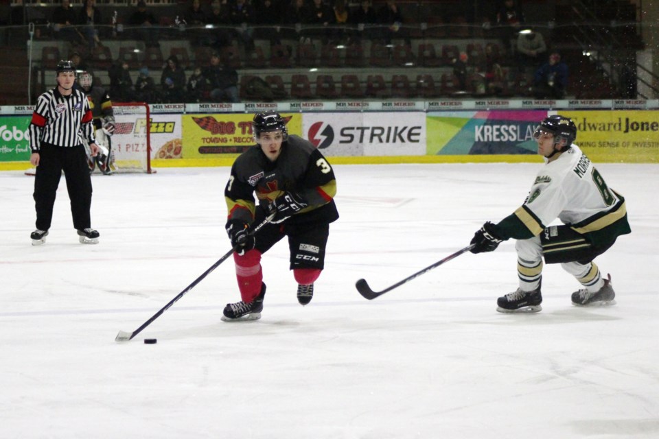 During the Bonnyville Jr. A Pontiacs game against the Okotoks Oilers on Saturday, Jan. 18, Jaxsen Wyatt keeps the puck away from his opponents. Photo by Robynne Henry. 