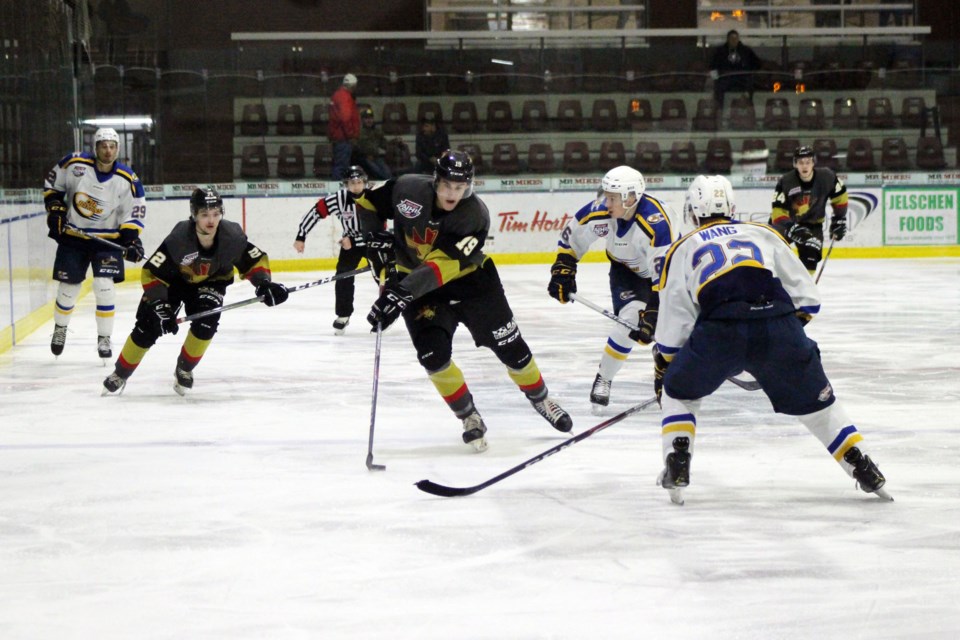 During the last home game in the Bonnyville Jr. A Pontiacs’ exhibition series against the Fort McMurray Oil Barons, forward Michael Fairfax makes his way up the ice. Photo by Robynne Henry.