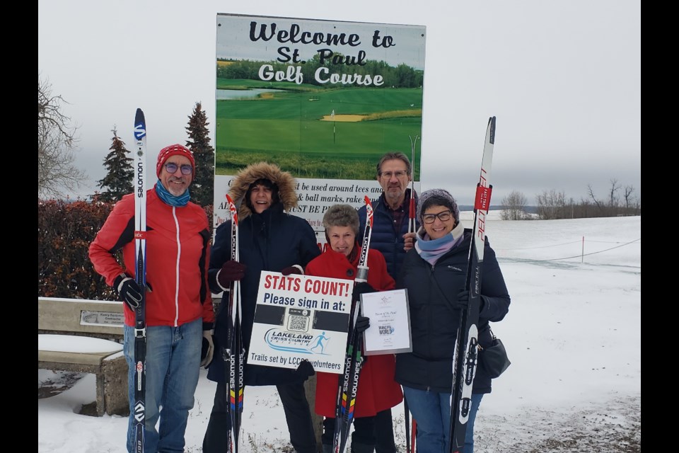 Proving that St. Paul is a community that offers opportunities year-round, representatives from the Lakeland Cross Country Ski Club pose with Mayor Maureen Miller and St. Paul Champions for Change Communities in Bloom committee members, Penny Fox and Judith Hess. Pictured from the ski club is Pierre Lamoureux and Dave Shankowski. 