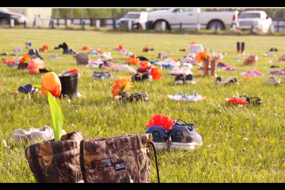 A field of 215 shoes and footwear at the Buffalo Lake  Metis Settlement's community centre.