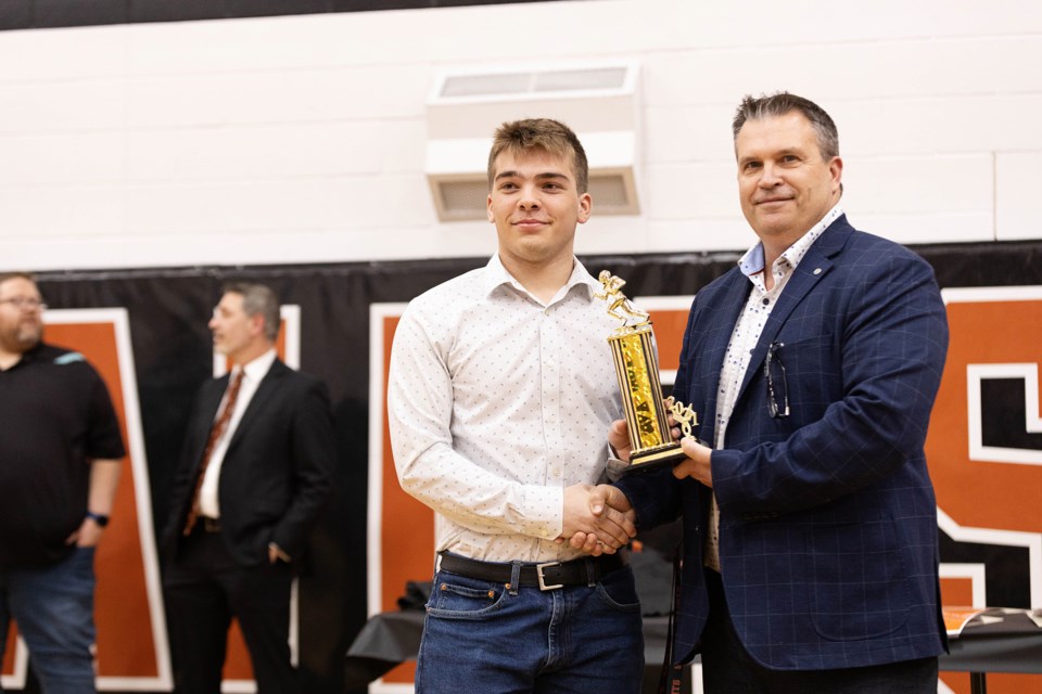 Lions MVP Ryan Fodchuk receives his award from Coach Tichkowsky.