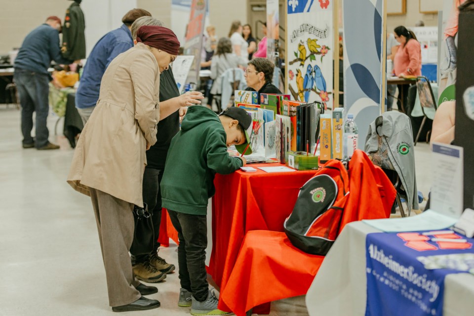 Attendees browse the tables at St. Paul's Community Awareness Night, Sept. 13.