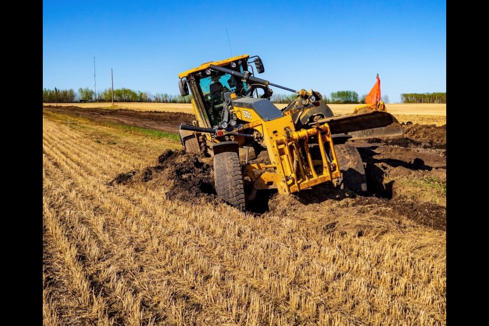 A grader is stuck in mud along a rural farm road near Atmore. Althought there have been some 'blue-sky breaks' the area has recorded more than four times the amount of rainfall than average in the last two weeks.       Image: Andron Frolov