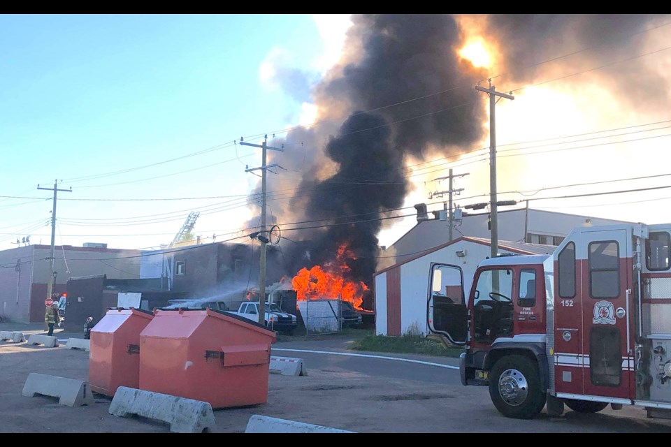 Thick smoke and flames greeted firefighters and emergency crews at Monday night's downtown fire.     Image: Neil Timm