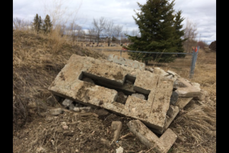 It's not just local business and industry, municipal debris can be found sitting behind the Lac La Biche cemetery across from a residential subdivision.