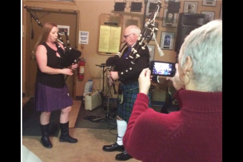Molly Fyten in her kilt and bagpipes gets her photo taken as she plays with instructor and Robbie Burns night guest Angus  Campbell at the 2020 event at the Lac La Biche Legion. The 2022 version of the tribute to the 18th Century Scottish poet  is slated for January 22. Tickets are $40 and there are only 50 available.       Rob McKinley-File