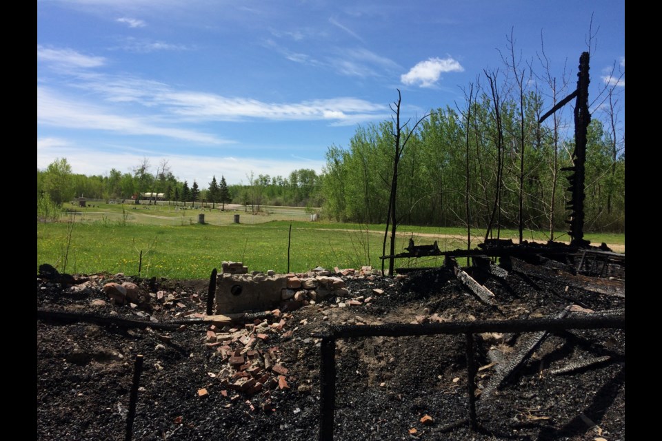 With the cemetery in the background, the black, charred remains of the Big Bay Church near Owl River, about 20 kilometres north of the Lac La Biche hamlet.