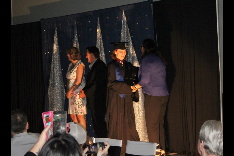 Ethyn Condon walked across the stage during the Bonnyville Outreach School's 2025 graduation ceremony.