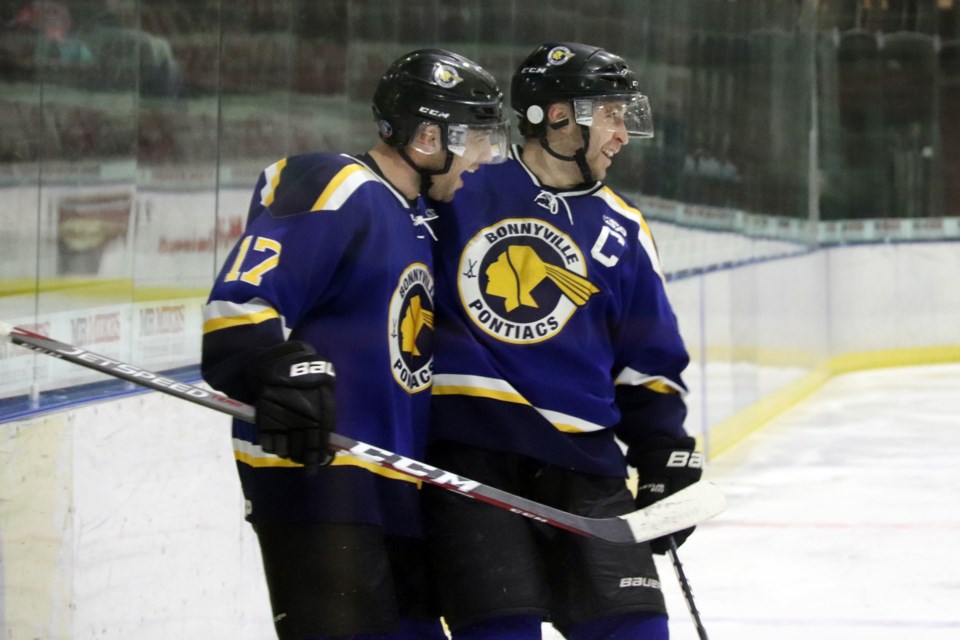 Tanner Corbeil and Lucas Isley grin after Corbeil scores the team's very first goal of the night. Photo by Meagan MacEachern