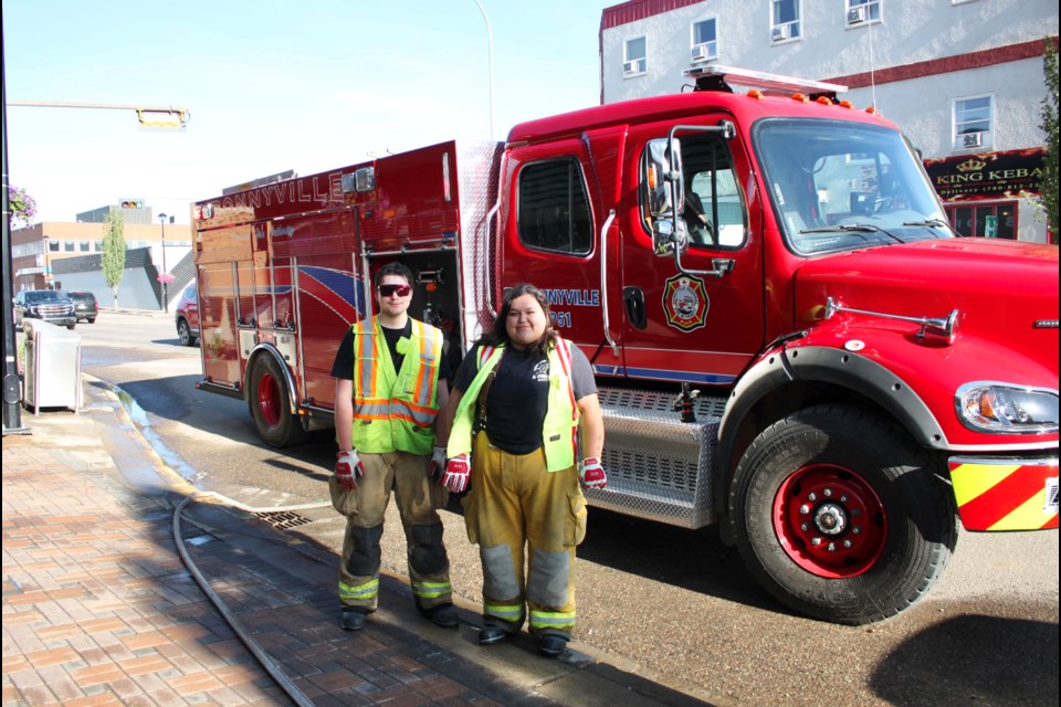 The Bonnyville Regional Fire Authority participated in it's annual sidewalk clean up, giving Main Street some spring cleaning. From the left: Lieutenant Taras Straughan and firefighter Kali Paradis 
