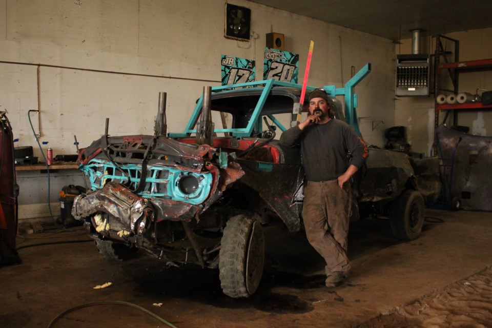 Derek Cote and one of his pre-run derby vehicles.