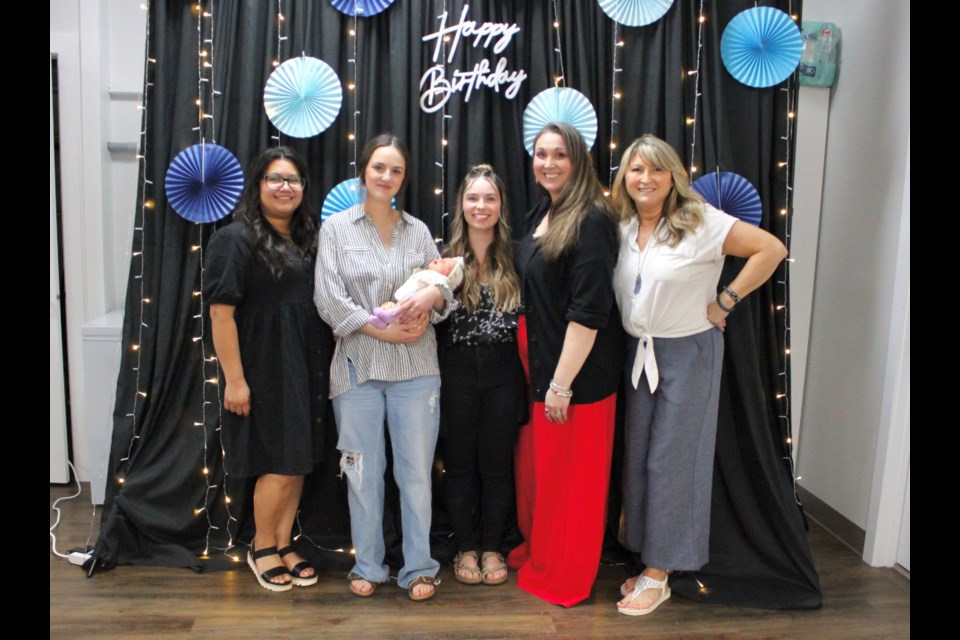 The Hive staff celebrated at their 3rd anniversary. From the left: Ingrid Seitz, Keara Mack with baby Della Mack, Kaylee Picray, Grace MacLellan, and Penny Vasseur.