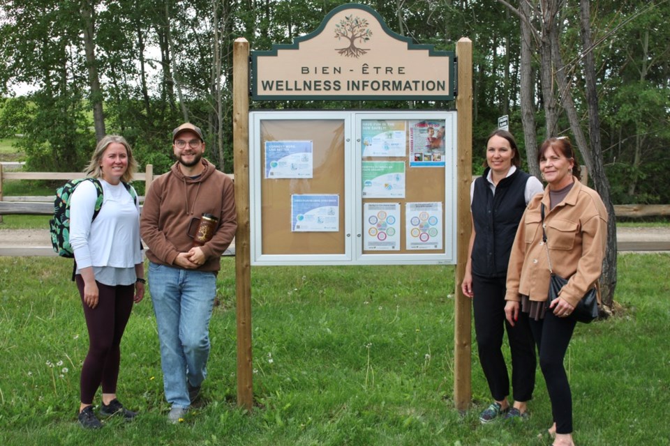 The Bonnyville Wellness Coalition gathered at Vezeau Beach Park to reveal their new Wellness Information Board and Picnic tables. From the left: Andrea Woods, Michael Procinsky, Danielle Larsen, and Heather Zink.