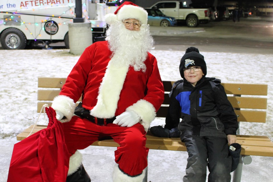 Eric Mahe, 5, poses for a photo with Santa Claus during the Bonnyville and District Centennial Centre’s Santa Claus Parade After Party on Saturday, Dec. 7. - Photo by Robynne Henry
