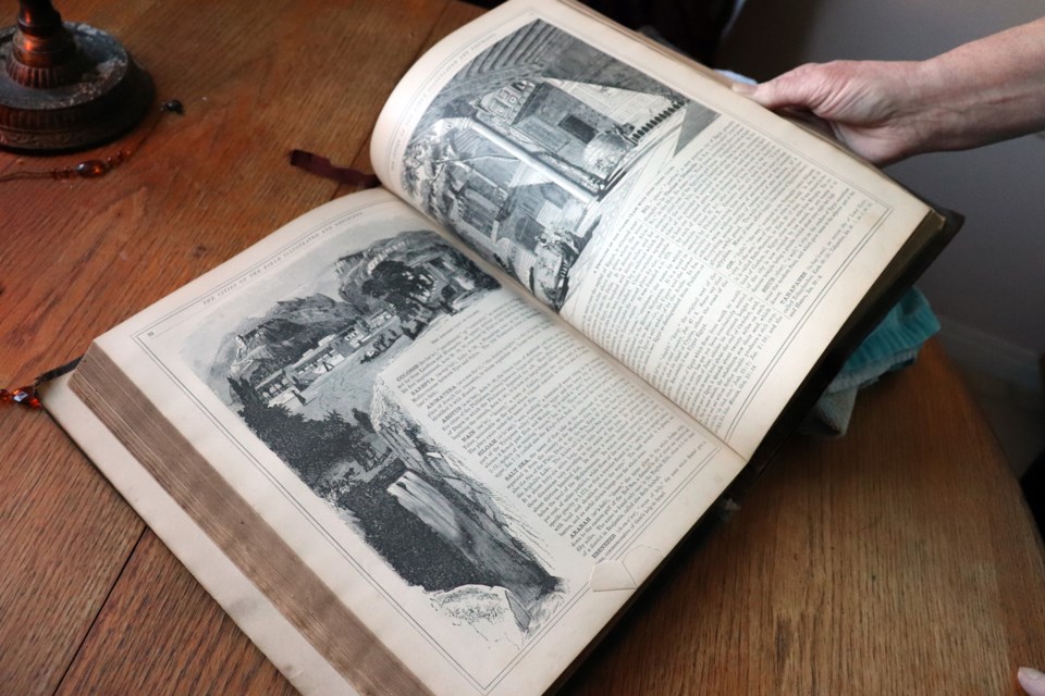 Jackie Peterkin is hoping to reunite this old Bible with its rightful family after purchasing it at a garage sale 23 years ago. Photo by Meagan MacEachern