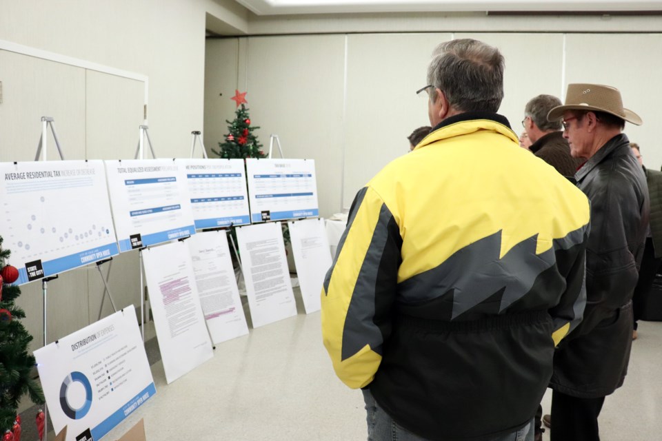 Residents reviewed the information boards prior to the city's presentation on Wednesday night. Photo by Meagan MacEachern 