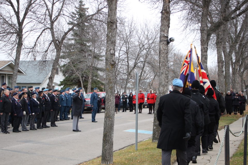 The Colour party marched the flags past WWII veteran William McGregor with members of the Bonnyville Legion and 4 Wing Cold Lake behind him.