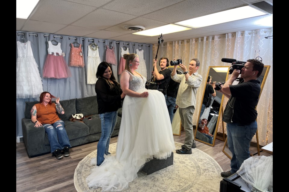 Ranchmans' Farm and Feed store manager Samantha Hines zips up Sarah Young as the Horse Warriors film crew captures the moment for their upcoming documentary.
Photo courtesy Neil Grahn