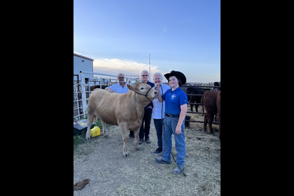 Town of Bonnyville Coun. Brian McEvoy, Coun. Phil Kushnir, and Deputy Major David Sharun purchased Bonnyville 4-H member Joseph Janz's steer during the Bonnyville and District Show and Sale.