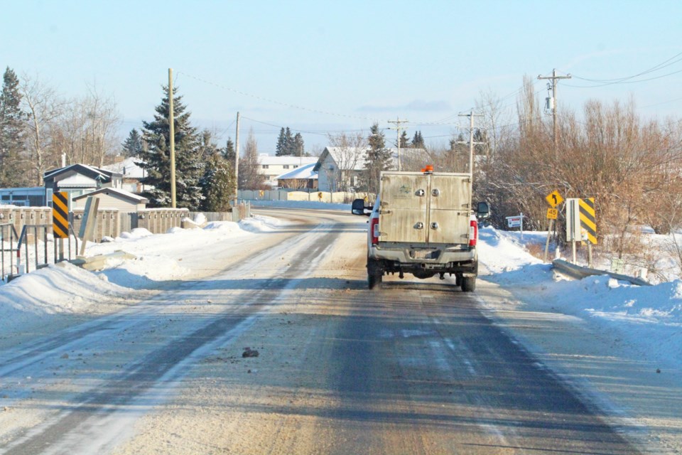 A Lac La Biche County service truck crosses the Nashim Bridge last Friday. Work starting on February 1 on the flood-damaged foundation of the crossing is expected to affect vehicle and pedestrian traffic along the portion of road for the day.     Image Rob McKinley