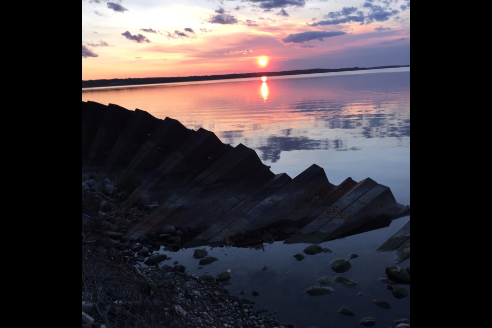 Pressure from winter ice and the wind-driven waves of summer have taken their toll on a decades-old retaining wall structure beneath a Lac La Biche street.  
Image: Rob McKinley