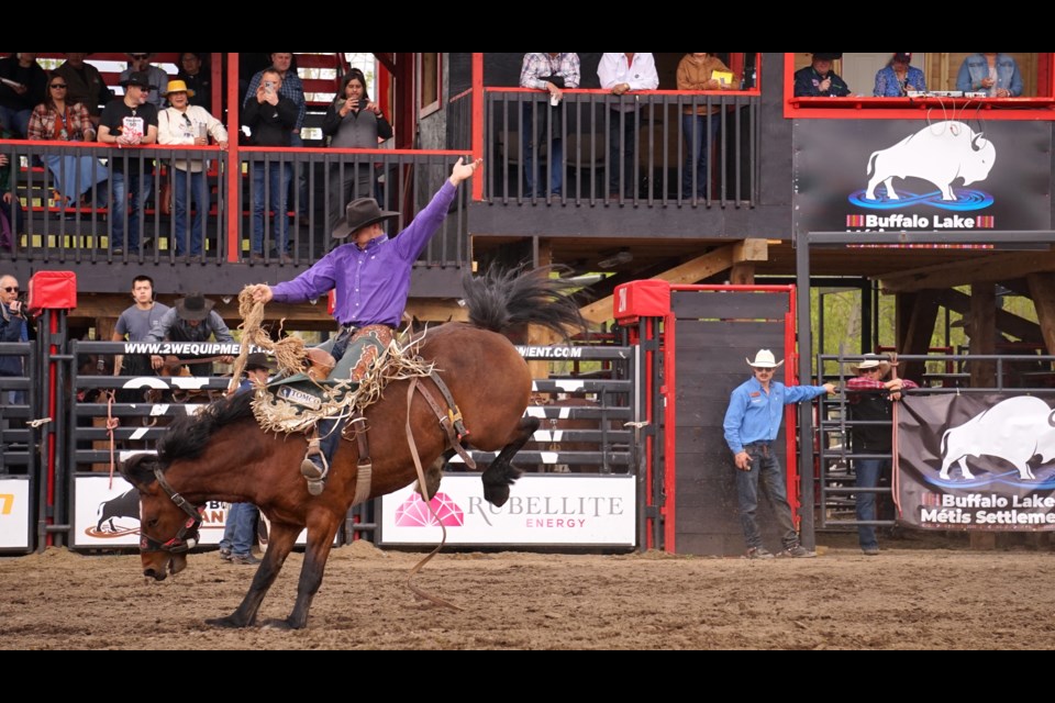 Bonnyville Pro Rodeo's 2023 saddle bronc winner Kole Ashbacher was back in the arena May 26 for the final day of the second annual Buffalo Lake Métis Settlement Pro Rodeo. Ashbacher, hailing from Arrowwood, Alta., rode Lac La Biche-based C5 Rodeo Company’s bronc Papow as spectators look on.                  