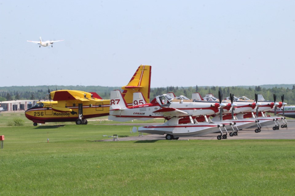 The Air Tanker base at the Lac La Biche Airport has been busy over the last week. Planes like the yellow CL-215 and the white Air Tractors have been providing forest fire assistance across northern Alberta.  The smaller aircraft in the air is the “bird-dog” plane, which is the spotter plane that helps to direct the water bombers to their targets. The Lac La Biche area is home to the water bomber base, forest-firefighting helicopters and firefighter crew camps.
 
