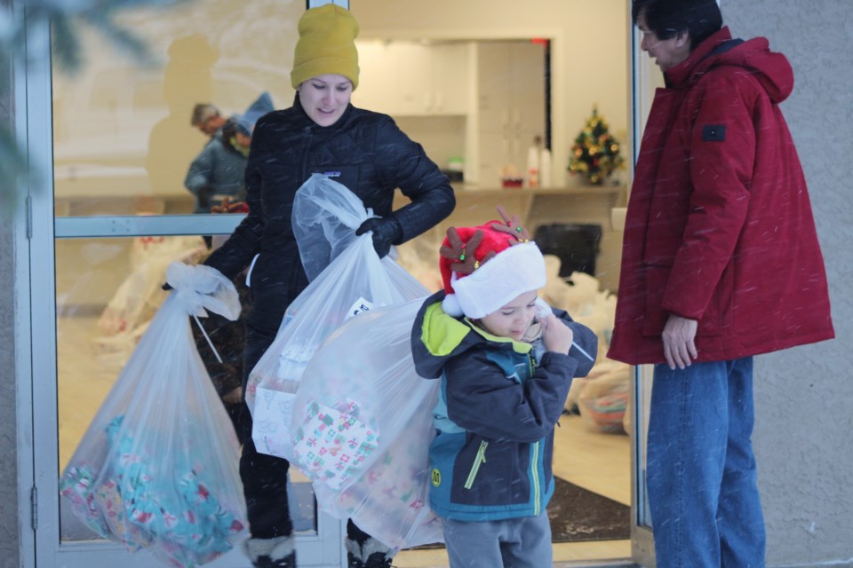 On Dec. 17, community members braved a winter storm to deliver Christmas cheer through the Knights of Columbus food hampers and the BCHS's Santa's Elves Program.