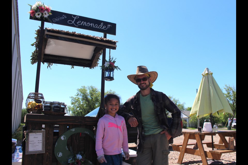 Shirina Gambell, 6, and her father Katlan Gambell are pictured on Lemonade Day in Bonnyville.