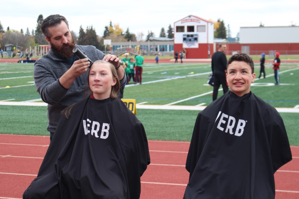 Bandits players Anders Hempel (right) and Hunter Scott raised donation pledges to shave their hair for a great cause.