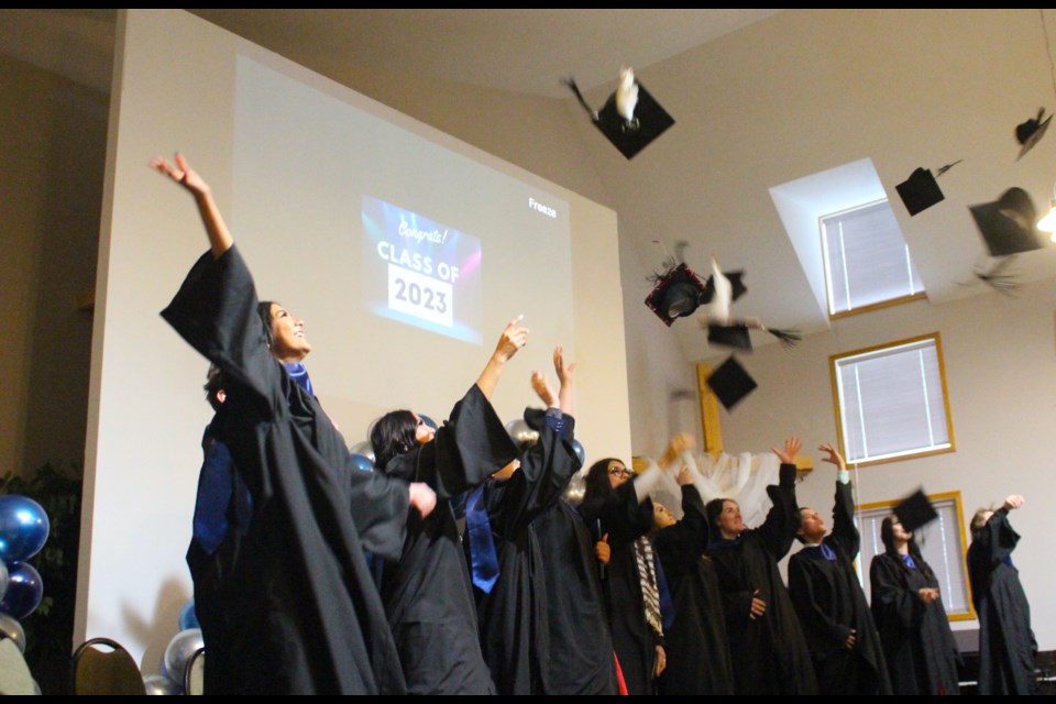 Bonnyville Outreach graduates toss their caps at following the end of their commencement ceremony held on June 15 at the Bonnyville Alliance Church.