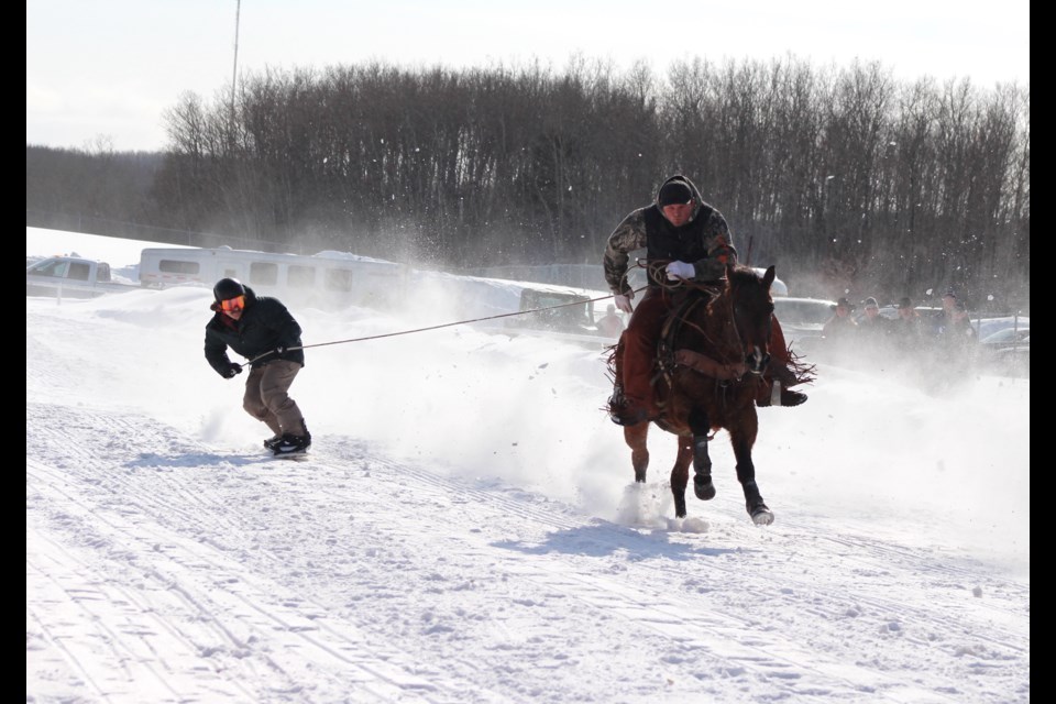 In Team Full Withdrawal, slider Dustin Collette is pulled by teammate Chase Soderburg riding Cissco, in the the Sprint Race.