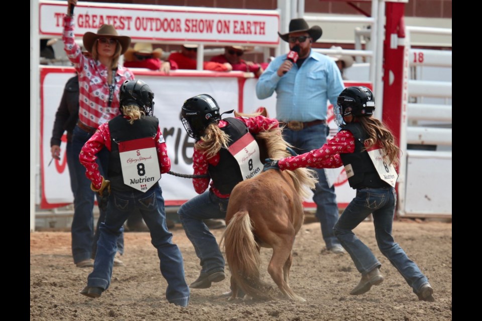 Local Lakeland girls Adley McMann, Layla Purdy and Sawyer Welch got the fastest time of the day on July 12, 5.7 seconds, during the Calgary Stampede's wild pony races.