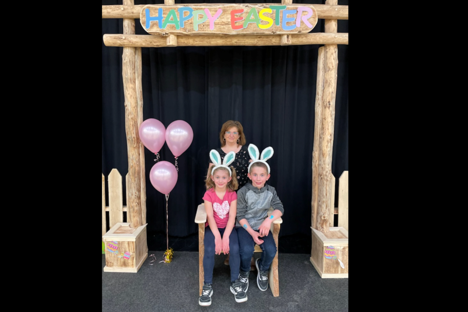 Andrea Ulliac and her two children, Alicianca Ulliac (right) and Noah Ulliac, at an Easter-themed event on April 14.
While the family enjoys the early celebrations, Ulliac is also volunteering at the community event.