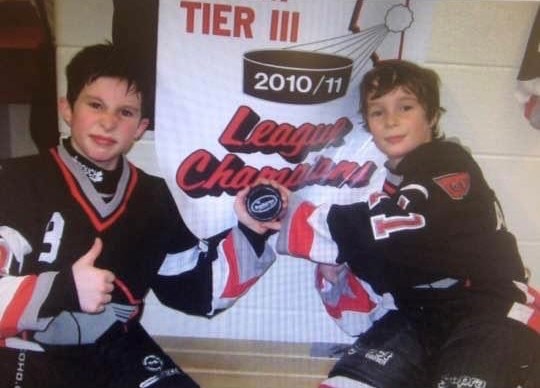 Brothers Austin (right) and Cody (left) Saint celebrate winning League Championships with their Bonnyville Minor Hockey team during the 2010/11 season. 