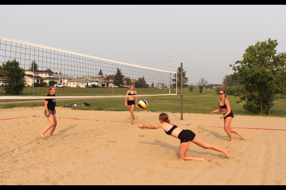 Utilizing the new beach volleyball courts on the shore of Jessie Lake to practice for Summer Games and provincials are Emily Kozun, Katie Brown, Faith Noble and Georgia Parker.