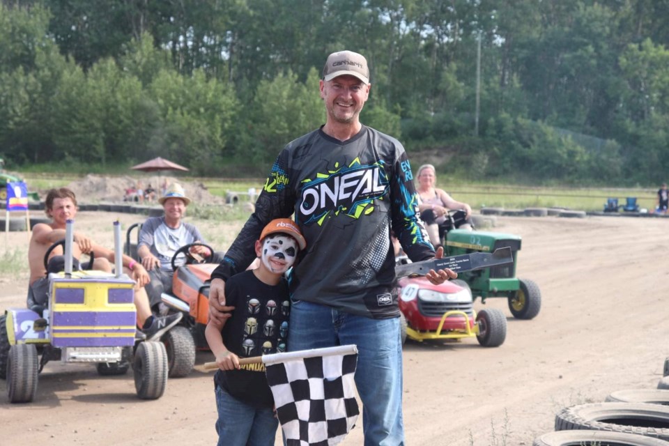 Nathan Zacharias's first place win in the Modified class earns him a  coveted Cherry Grove Lawn Tractor Blade Trophy.
