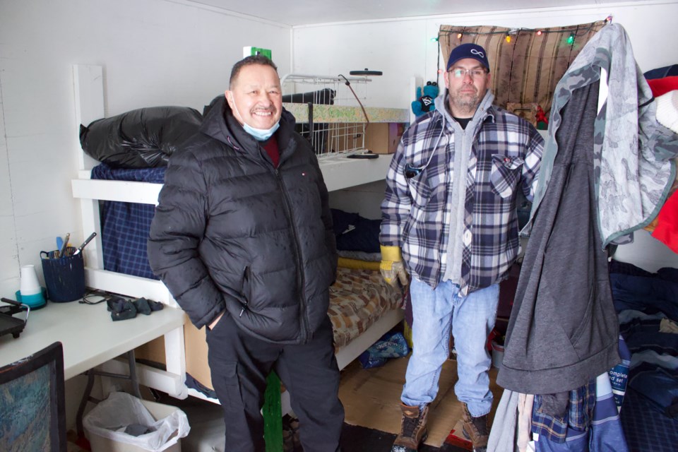 MNA Region 1 President, James Cardinal(left) and MNA Region 1 Vice President Jason Ekeberg in one of the shelter units at the Bonesville subdivision, located five kilometres south of the hamlet of Lac La Biche, that has been utilized consistently.