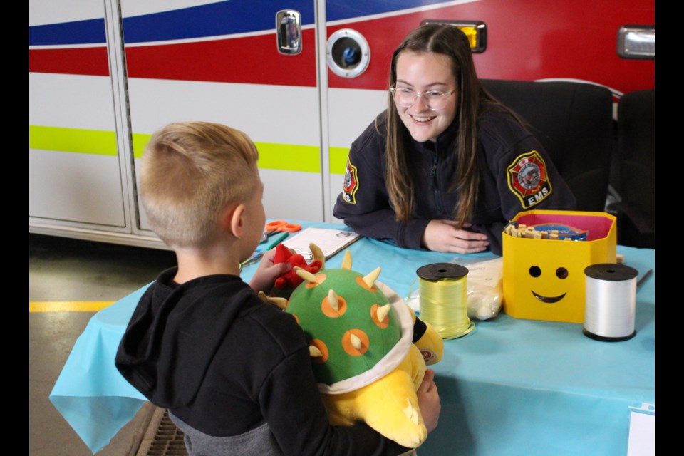 Bonnyville paramedic Olivia Wudrick provides teddy bear First Aid during an EMS open house. Austin Sidorenko brought his Bowser stuffed animal to the First Aid clinic but noted he had no injuries but would like a sticker.