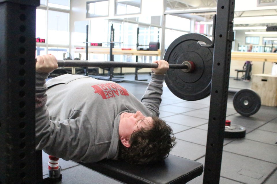 Carole Vachon received silver hardware in her M1 84-kg group at the CPU National tournament after lifting a combined weight 437.5 kg in Unequipped 3-Lift. Pictured is Vachon working out at the Bonnyville and District Centennial Centre.