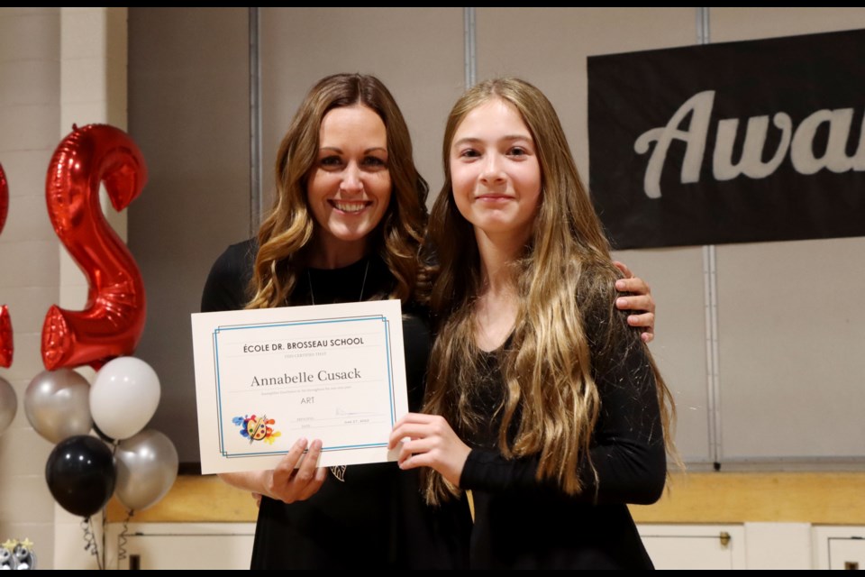 Vice Principal Jilliane Smyl presenting Annabelle Cusack with the Art Award during an awards evening at Dr. Bernard Brosseau Middle School held on June 27.