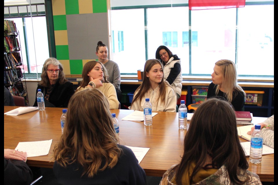 Grade 8 students who are a part of Dr. Brosseau School's Leadership Team, Kaylee (left) and Neddie (right), collaborate with Lakeland Catholic's board of trustees members to improve student education and well-being. Also pictured is superintendent Pamela Guilbault (right) and trustee Donna Cloutier (left).
