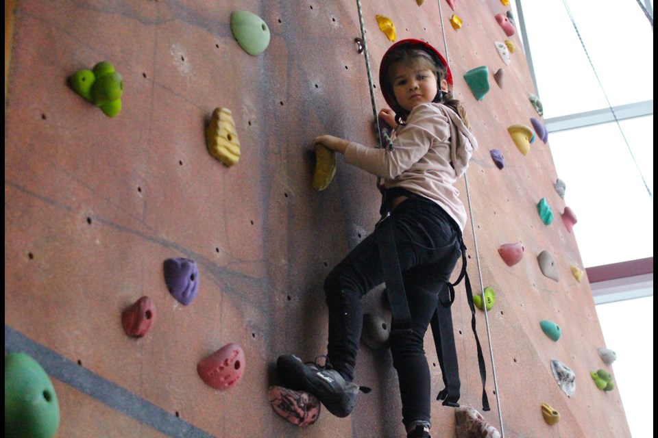 Sawyer Antoniuk, 5, had no fear as she scaled the new Federation Group Climbing Wall at the C2 during the Spooktacular Fun Day on Saturday.