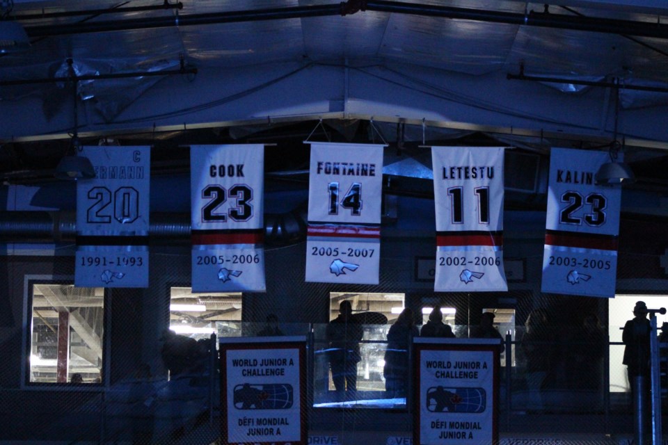 Justin Fontaine's #14 Pontiac Jr. A jersey is raised to the rafters of the RJ Lalonde Arena during a jersey retirement ceremony on Jan. 21, 2023.