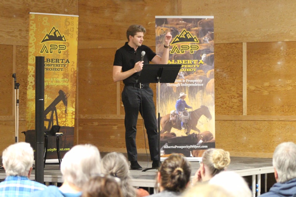 Speaker Tanner Hnidey, VP of economics for the Alberta Prosperity Project presents to Bonnyville and area residents on June 17 at the Bonnyville Rodeo Grounds Hall.