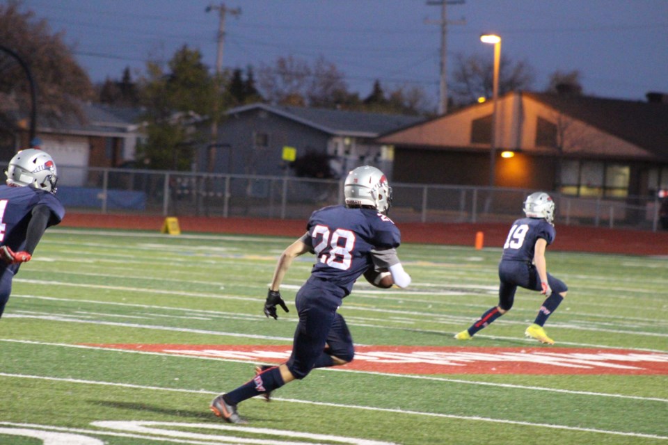 Aiden Lawton, Voyageurs #28, drives forward following a kick-off.
