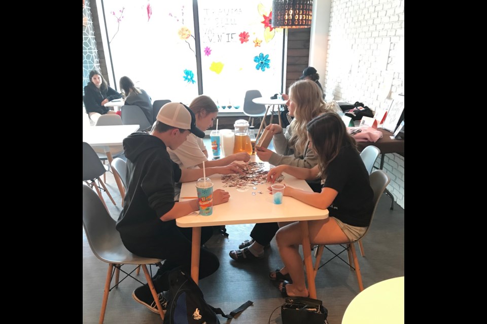 Bonnyville youth got puzzling during the opening week of The Hive Lakeland Youth Hub in the café area.